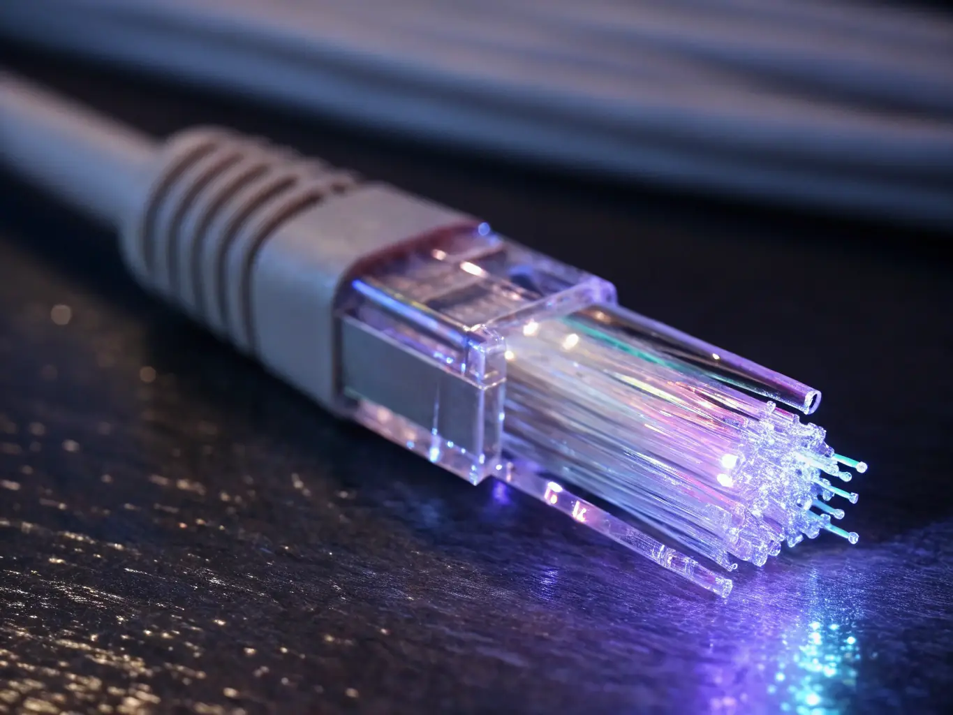 A close-up image of a fiber optic cable transmitting data at high speed, symbolizing the advanced technology behind Birmingham Fibre's internet service.